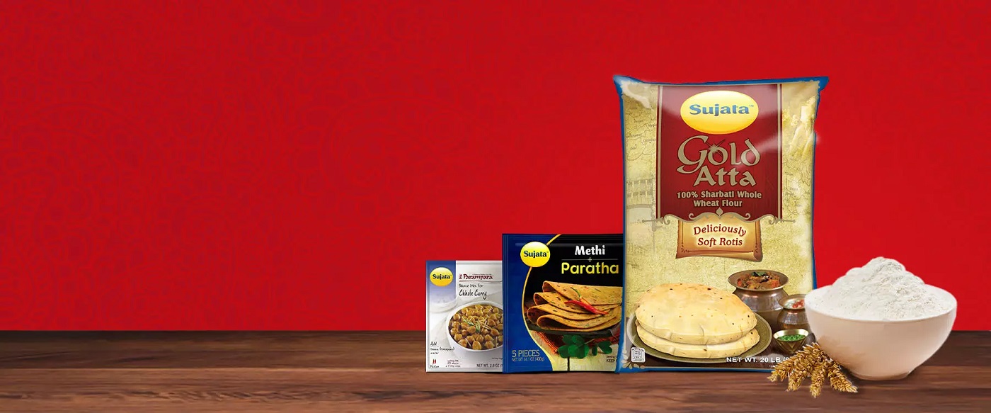 Sujata product packages on wooden surface with red background